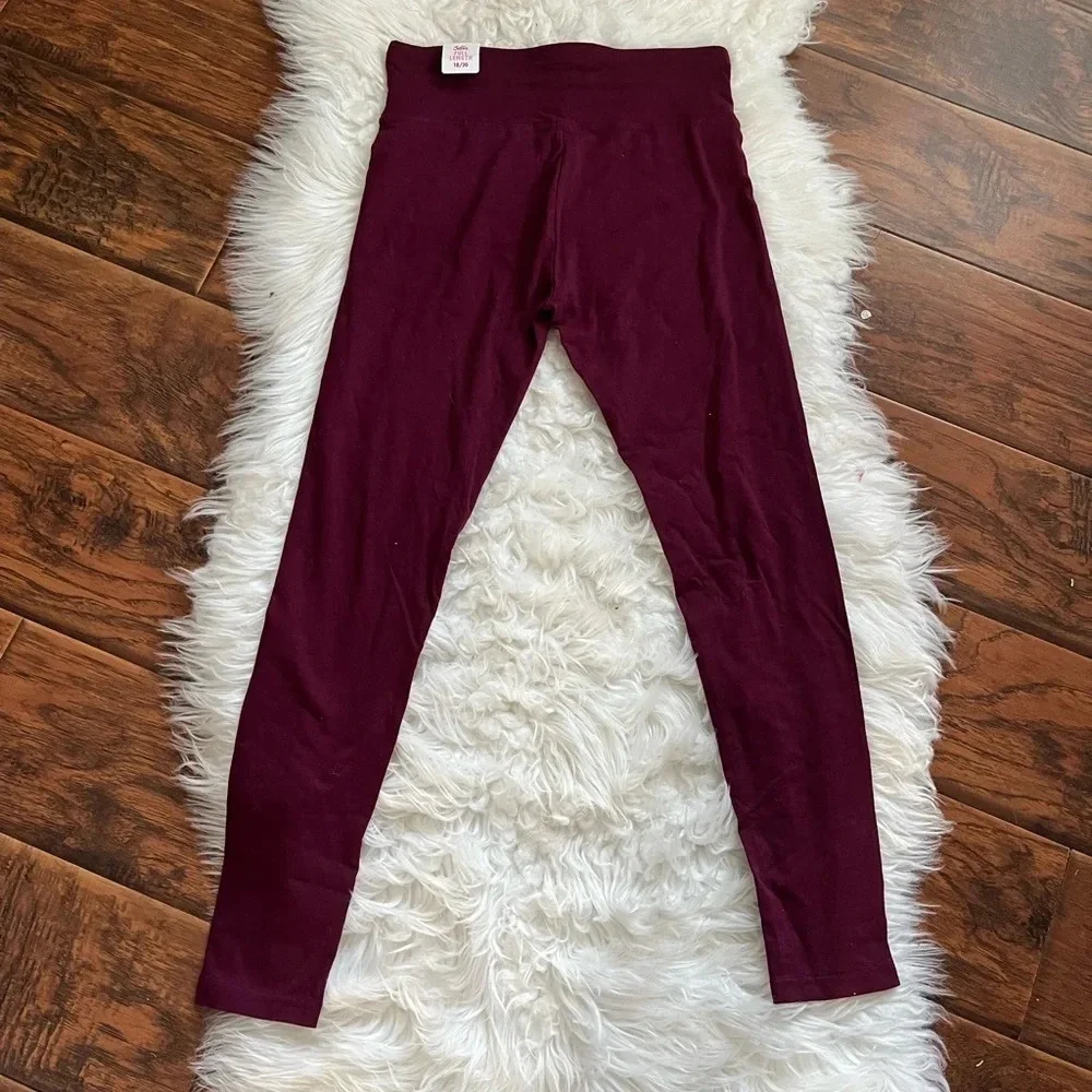 Justice burgandy leggings Size 18/20
